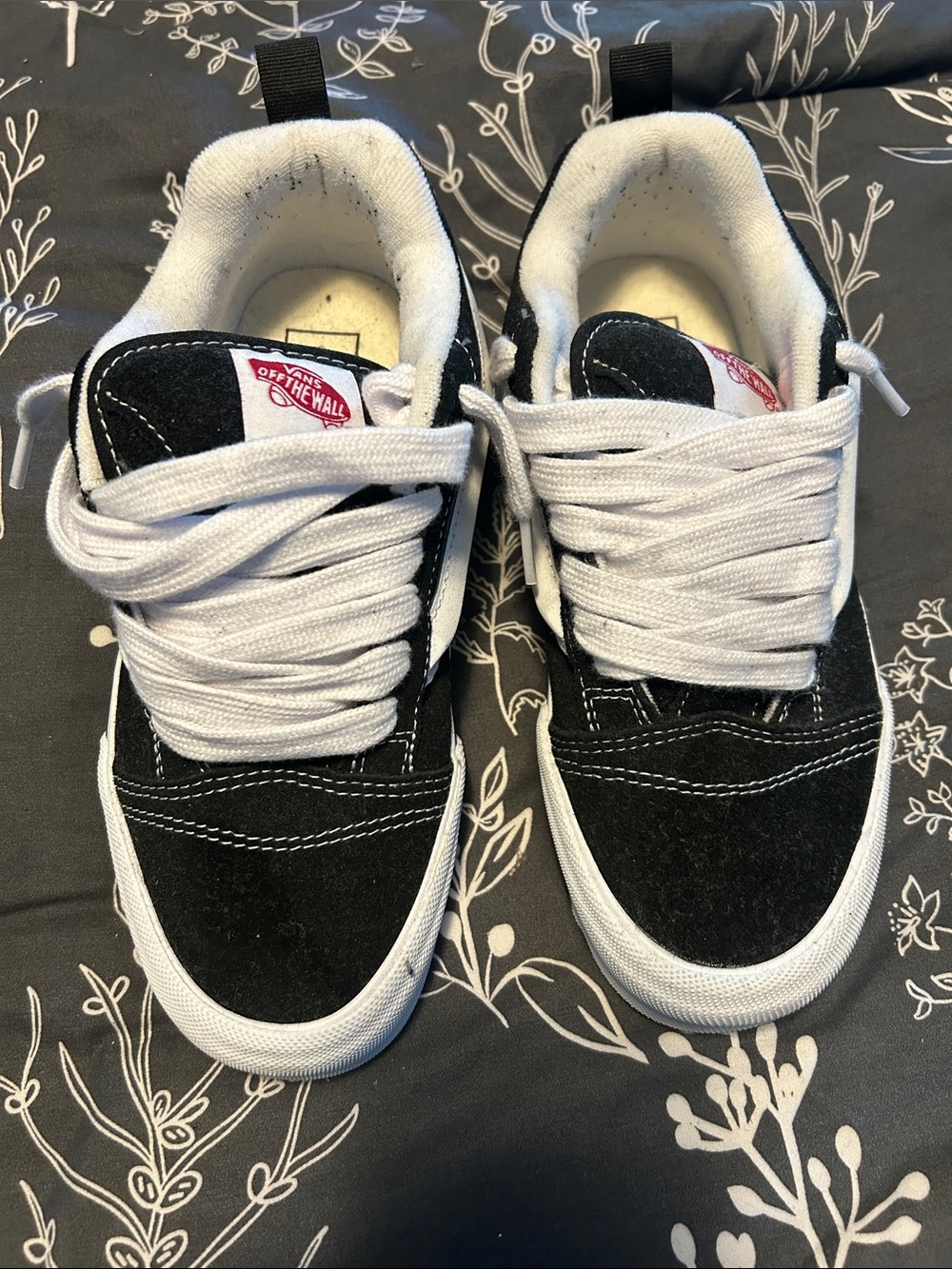 Vans women’s Black and White Low-Top Skate Sneakers